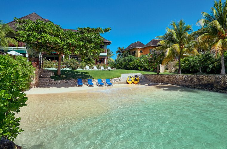 Beach with chairs and kayaks